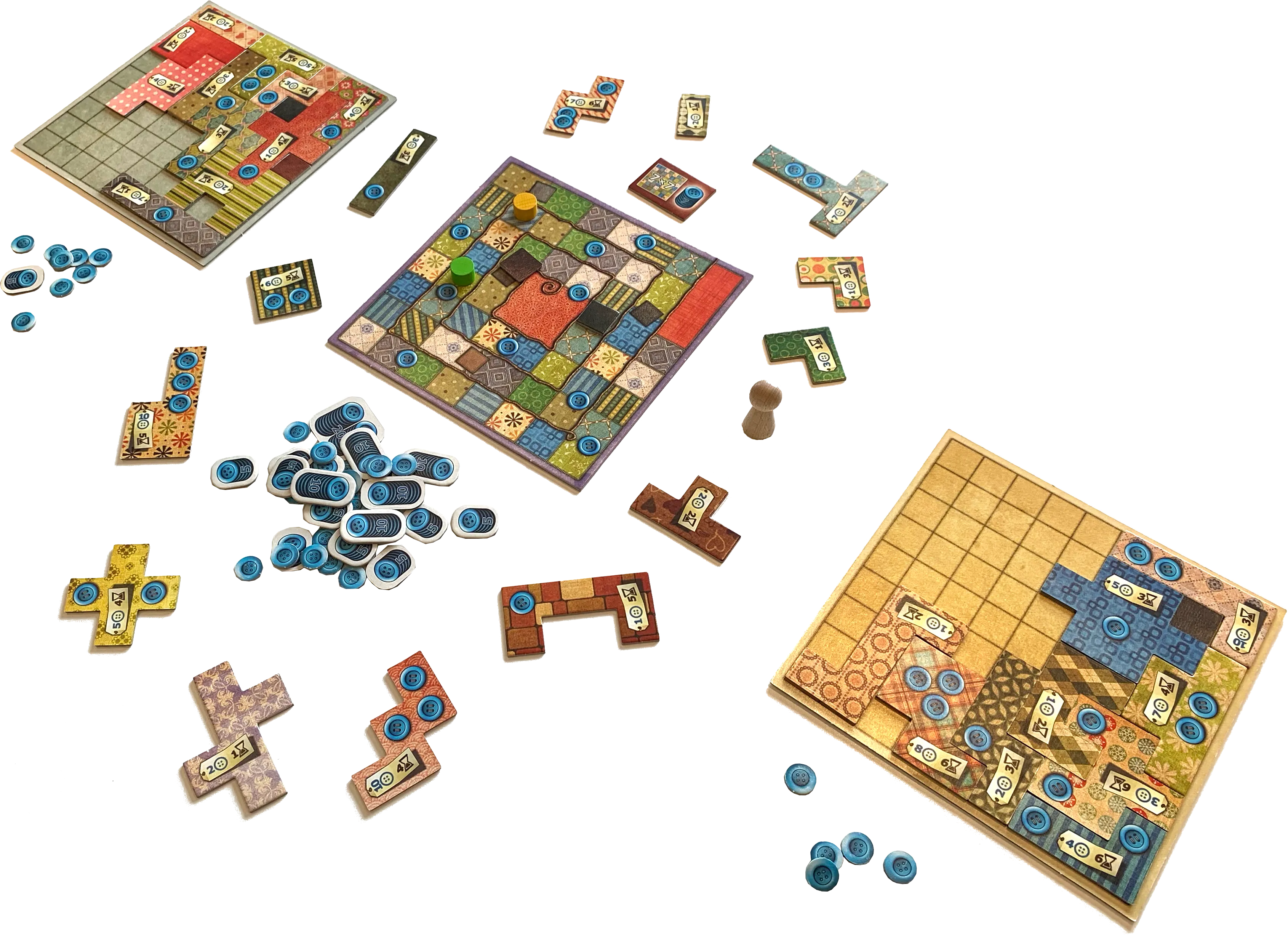 Patchwork board game in progress with boards, tiles, and buttons